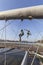 Hanging iron figures balancing on ropes on footbridge Bernatka,Krakow, Poland