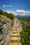 Hanging ladder over a precipice in the mountains.