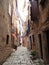 HANGING LAUNDRY IN A NARROW COBBLESTONE STREET, ROVINJ, CROATIA