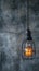Hanging lightbulb industrial concept on cement background design