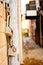 Hanging Locks and Chains Near Alley Between Buildings