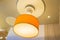 Hanging orange glow creative design lamp on restaurant ceiling for decoration