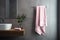hanging pink towel in modern bathroom