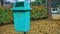 Hanging plastic waste bin in a residential area