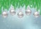 Hanging silver Christmas balls with pine leaves on blue background, Christmas backdrop vector illustration