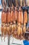 Hanging smoke-dried calamari or cuttlefish in a fish market