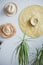 Hanging straw hats on white wall