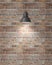 Hanging white lamp with shadow on vintage brick wall, background