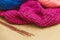 Hanks of bright yarn for knitting on a bright background