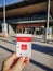 Hannover, Germany - April 2019: Caucasian hand holding a paper entrance ticket to the Hannover Messe