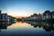 Hanoi cityscape at sunset. Resident buildings by Tien Bien lake, Gia Lam district