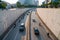 Hanoi traffic with vehicles running on Dai Co Viet crossing underpass tunnel exit