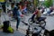 Hanoi / Vietnam, 05/11/2017: Backpacker watching busy hectic traffic with passing cars and motorbikes on a Hanoi street