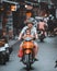 Hanoi, Vietnam - 18th October 209: A father drives daughter to school on a moped in the streets of Hanoi