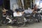 Hanoi, Vietnam - Aug 28, 2015: Motorcycle drivers sleep during lunch time at Long Bien market