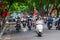 Hanoi, Vietnam Aug 29, 2022 : Motorbike riders on the busy roads, Heavy rush hour traffic in downtown Hanoi, Vietnam