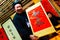 HANOI, VIETNAM, FEB 14, 2018: Old master is writing ancient letter for everyone in lunar new year in Hanoi, Vietnam. This is a