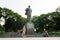 Hanoi, Vietnam - July 10, 2016: Vladimir Ilyich Lenin statue, with children playing game in Lenin park, Dien Bien Phu street