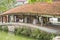 Hanoi, Vietnam - July 13, 2014: Unidentified people relax under ancient ceramic roof at Thay pagoda, Hanoi, Vietnam