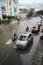 Hanoi, Vietnam - July 17, 2017: Traffic on flooded Minh Khai street after heavy rain with cars, motorcycles crossing deep water