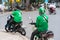 Hanoi, Vietnam - July 7, 2017: Grab motorbike driver waiting for customer on Ba Trieu street. Entered Vietnam in 2014, Grab growin