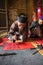 Hanoi, Vietnam - Jun 22, 2017: Scholar writes Chinese calligraphy characters in communal house at So village, Quoc Oai district. C