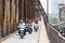 Hanoi, Vietnam - May 2019: people driving scooters and motorbikes on Long Bien bridge