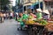 HANOI, VIETNAM - MAY 22, 2017: Woman selling tropical fruit on a