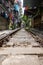 Hanoi, Vietnam - May 28, 2023: Train Street in Hanoi is a narrow, bustling lane with tracks. Close knit houses, adorned with