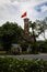 Hanoi, Vietnam - May 28, 2023: Vietnam Military History Museum and the Hanoi flag tower. 33 meters high tower features three tiers