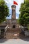 Hanoi, Vietnam - May 28, 2023: Vietnam Military History Museum and the Hanoi flag tower. 33 meters high tower features three tiers