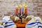 Hanuka menorah with burning candles.