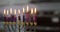 Hanukkah celebration judaism tradition family religious holiday symbols lighting candles on a hanukkiah menorah during