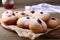 Hanukkah donuts with jelly and powdered sugar on wooden table, closeup