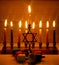 Hanukkah is a Jewish holiday. Burning Chanukah candlestick with candles. Chanukiah Menorah. dreidel, savivon