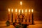 Hanukkah is a Jewish holiday. Burning Chanukah candlestick with candles. Chanukiah Menorah. dreidel, savivon