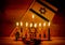 Hanukkah is a Jewish holiday. Burning Chanukah candlestick with candles. Chanukiah Menorah. dreidel, savivon. Flag of Israel