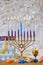 During Hanukkah Jewish religion holiday celebration, a Menorah candlelights