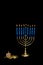 Hanukkah Menorah with a Dreidel and Gelt