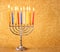 Hanukkah menorah over glitter background