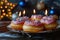 Hanukkah Sufganiyot Doughnuts with Star of David Decoration Illuminated by Soft Candlelight