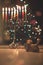 Hanukkah traditional chandelier menorah burning candles and spinning top toys dreidels on the background of Christmas tree