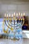 Hanukkiah Menorah candle is lit during traditional celebration of Hanukkah it is one symbols Jewish religion