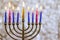 Hanukkiah Menorah candle is lit during a traditional celebration of Jewish holiday