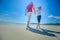 The happiest childhood: father and son walking along the tropical beach.