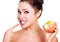 Happily smiling woman with a ripe apple
