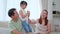 Happiness asian family mother father and daughter dancing together on sofa with enjoy and fun in living room.