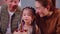 Happiness asian father and mother celebrate birthday with daughter while blow candle.