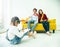Happiness family leisure time in living room togetherness .Asian family having good time at home sitting on floor and sofa,