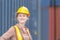 Happiness Female engineer in hardhat and safety vest, Smiling factory worker woman at container cargo